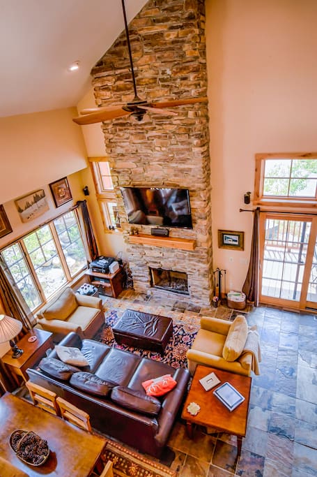 Living room with cozy fireplace and sleeper sofa.