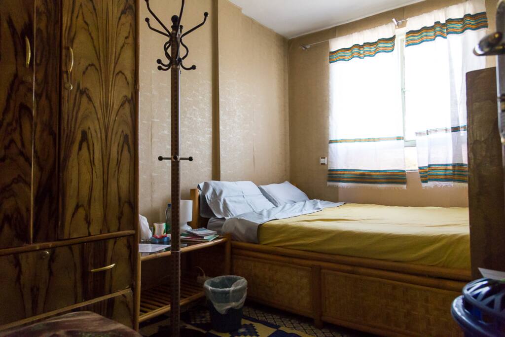 Room A (yours) with bed, side table, hanger, closet and drawers.