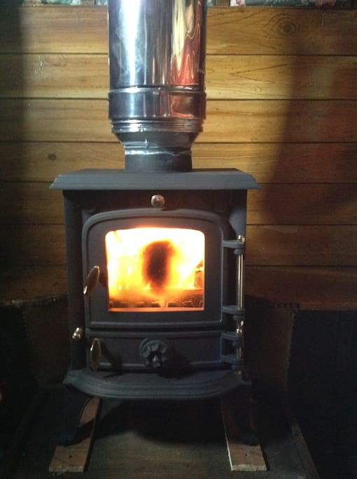 Cosy wood burning stove.