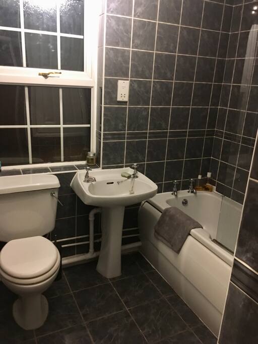 Bathroom with shower over bath