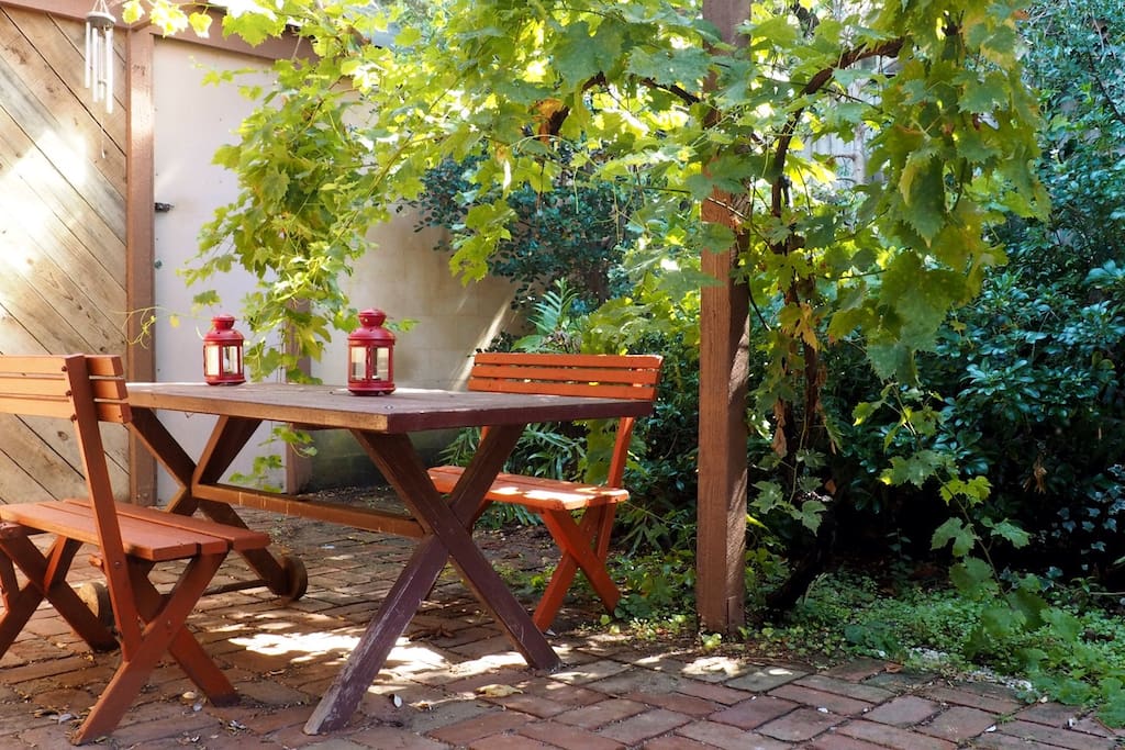 Outside dining under the grape vine