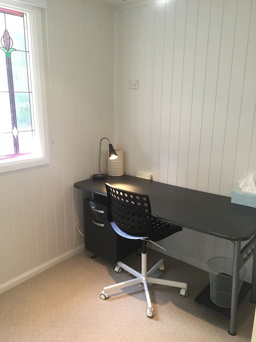 Study desk with unlimited wireless internet and easy-access power. There is now the addition of a large flatscreen TV on the wall above the desk for Netflix viewing from bed!