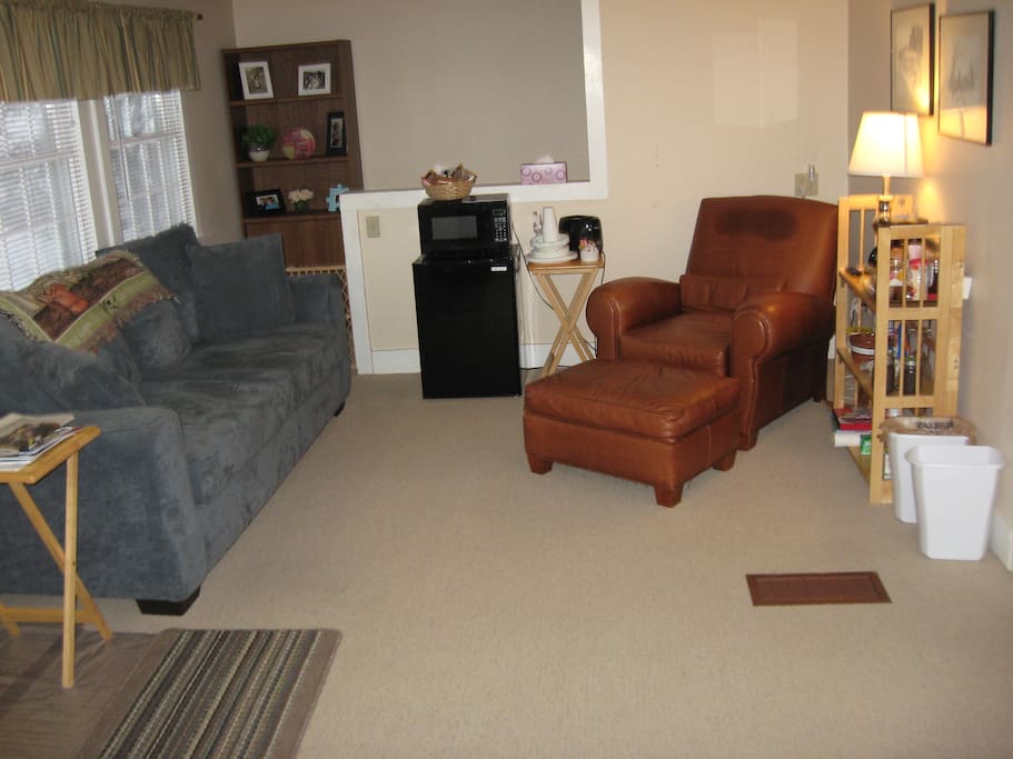 ComfortDen is 12' x 17' with 6' couch and comfortable recliner chair.able sitting/den/TV room.