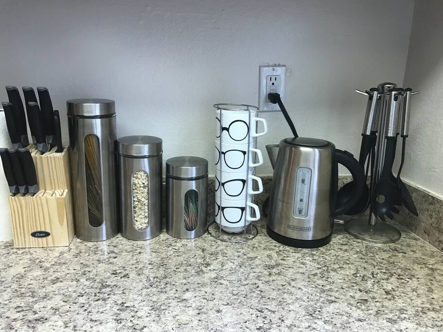 An electric kettle is available with tea and utensils