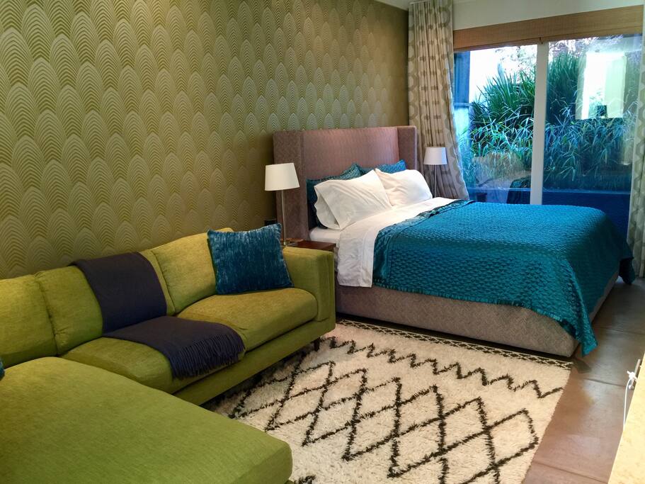 Elegant living and sleeping area with garden view