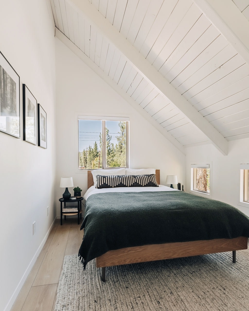 Bedroom #2 (upstairs) features a comfy queen bed and beautiful hand loomed Tribe + True blanket.