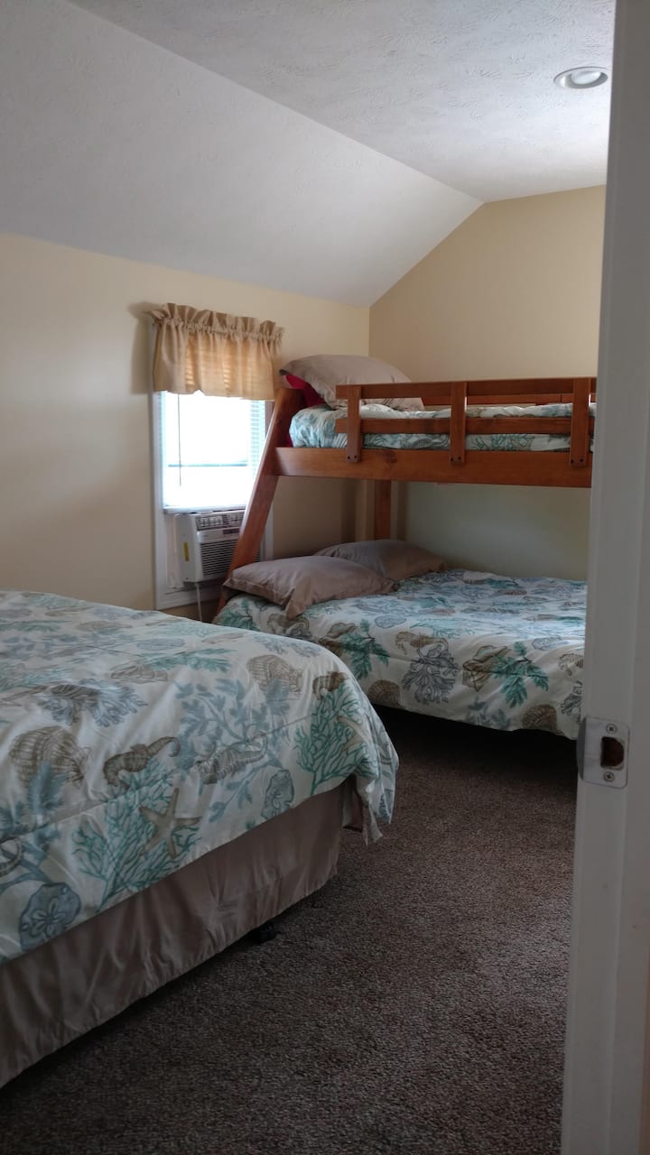 South bedroom has a queen, full and twin beds.