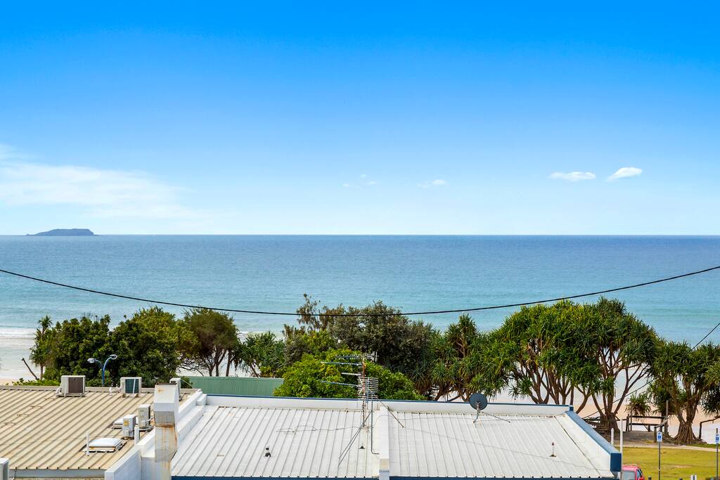 Standing on the deck, you will know when the surf's up! Roof in front is your closest cafe
