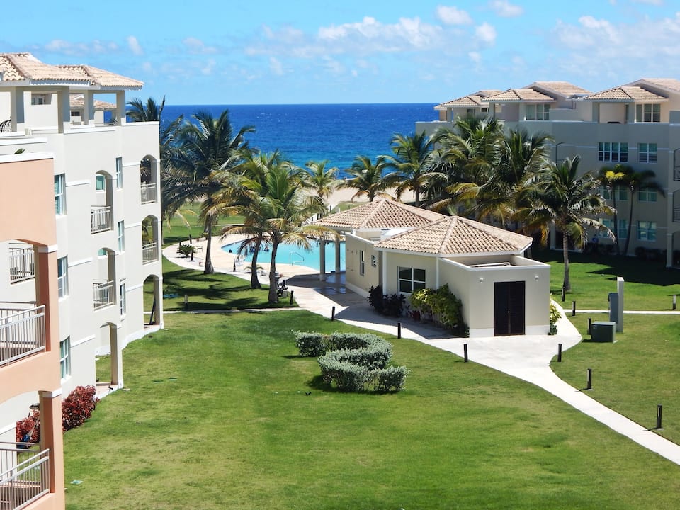 Haudimar gardens and pool with the ocean beyond