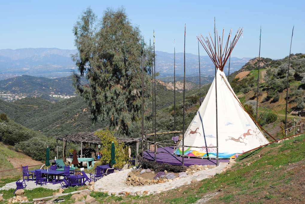 Outdoor seating area below tipi, amazing views.