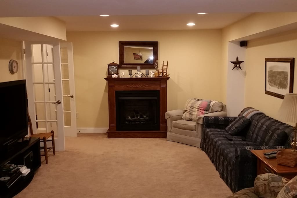 Living Room in our basement. TV, sofa, recliner fireplace