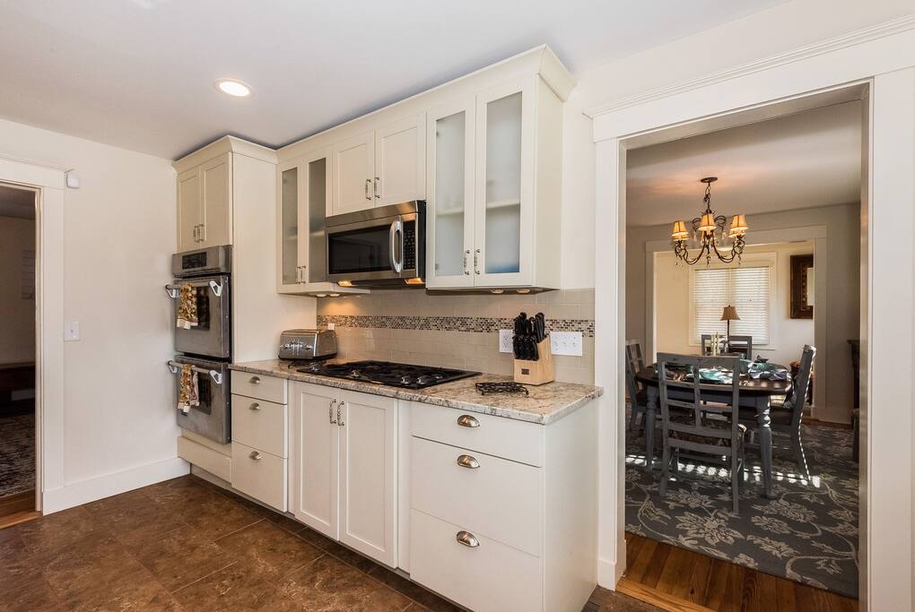 Modern Kitchen with granite counter tops and Jenn Air appliances