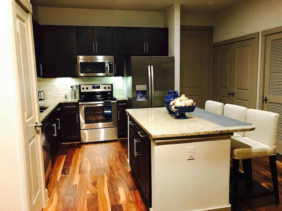KITCHEN EQUIPPED WITH ALL YOUR NEEDS...TOASTER, STOVE, OVEN, FRIDGE, ICE MAKER, UTENSILS, KNIVES, DISHWARE, POTS AND PANS.