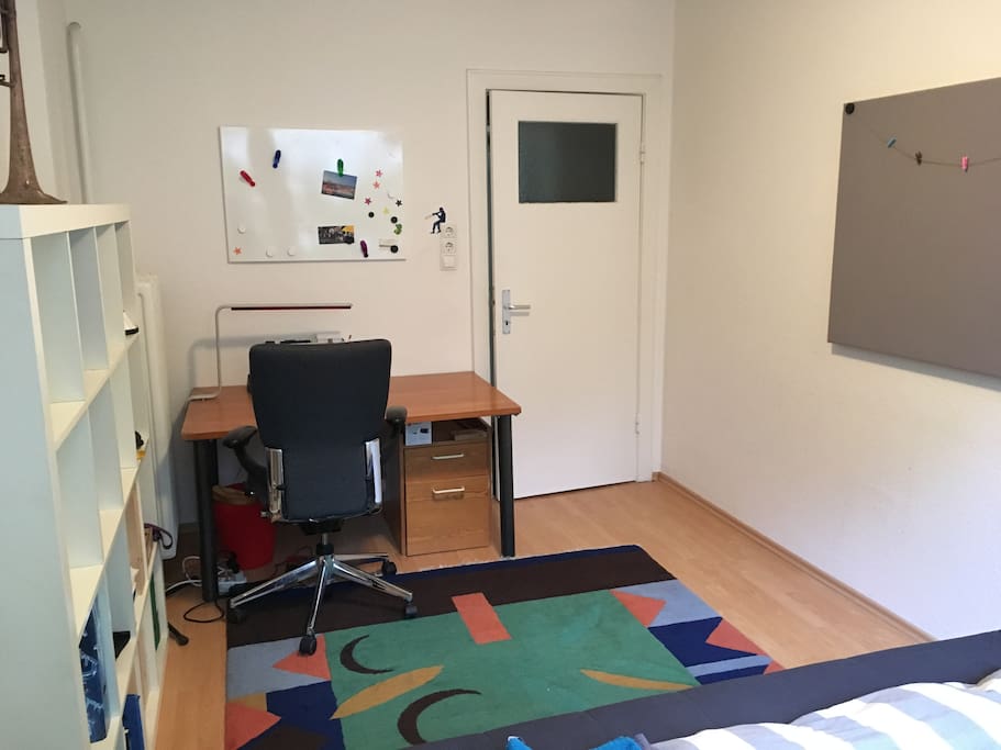 Bright room with bed and desk