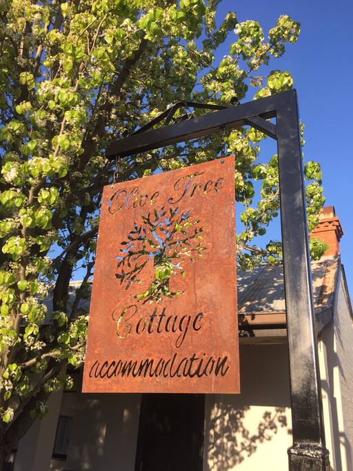 Olive Tree Cottage at the driveway entrance to the cottage.