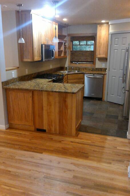 Fullly stocked kitchen including some food essentials like salt and pepper.