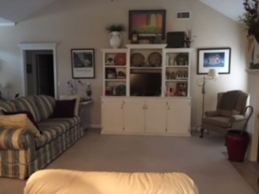 Family room with 2 recliners, chair and sofa TV has cable