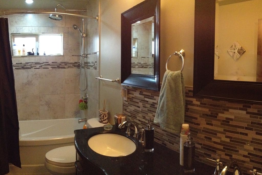 Main Floor Bathroom with Rain shower and Double sinks.
