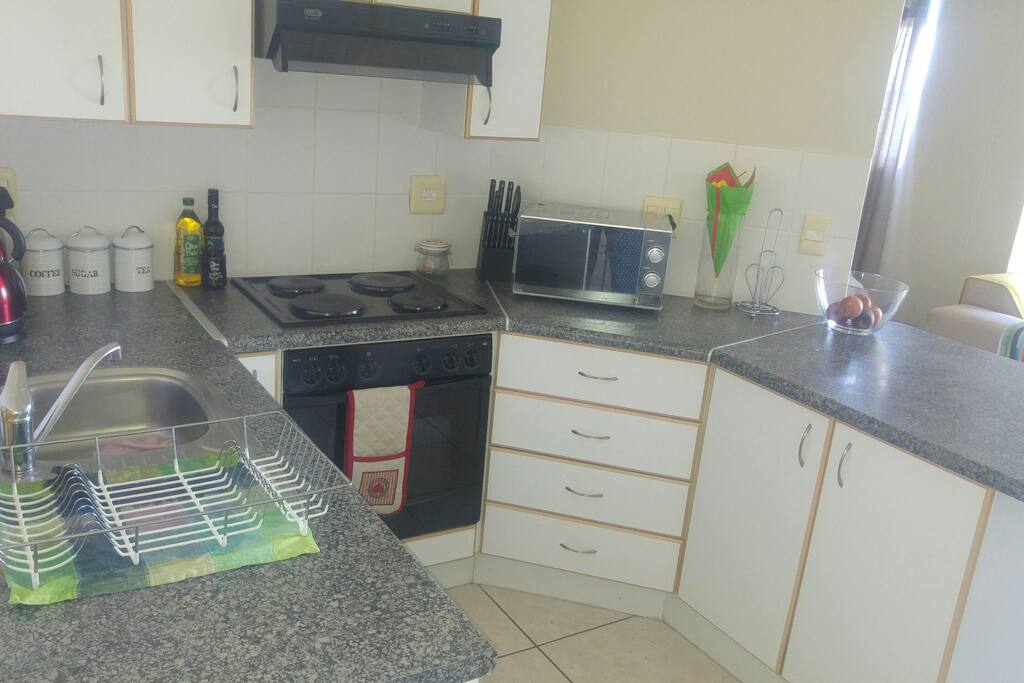 Kitchen with all the basic crockery, cutlery etc. Apartment is walking distance from shopping mall.