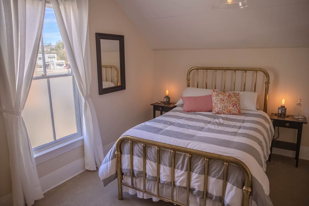 Your sunny bedroom overlooks Bell Street, at night you can see the lights in the garden at Full of Life Flatbread