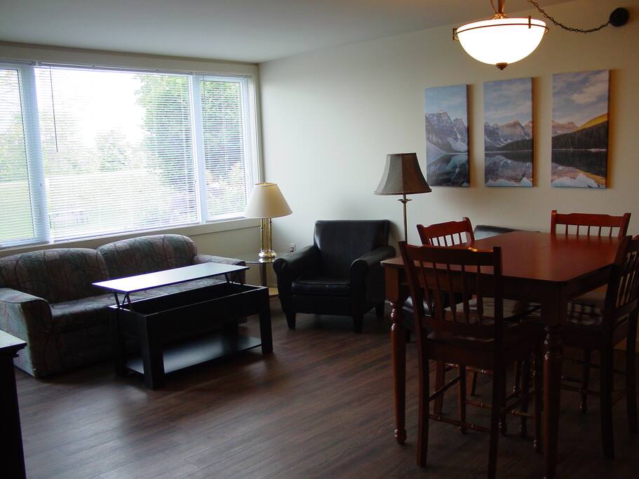 Spacious Living area with 50" TV and eating nook.