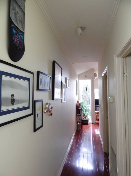 Sunlit hallway with art