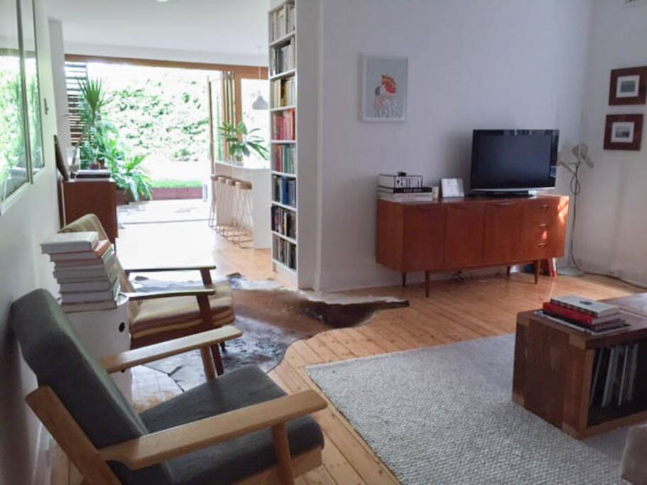 sitting room with large sofa and apple TV with Netflix