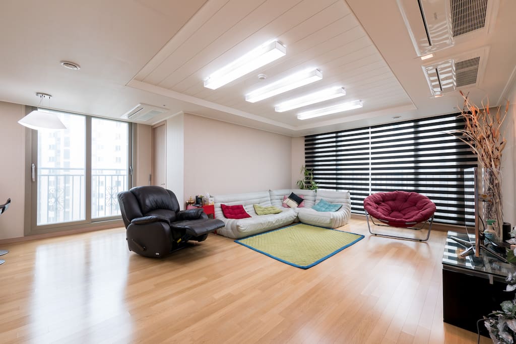 The livingroom is very spacious and full of furniture a family needs for comfortable staying: TV, air conditioner, air cleaner, sofa, chairs, wifi, VOD system, and many others.