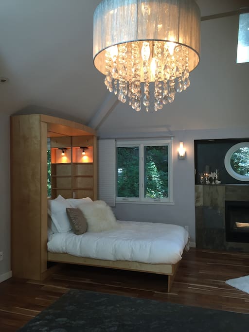 Comfortable queen size bed with Frette sheets. Next to the fireplace.