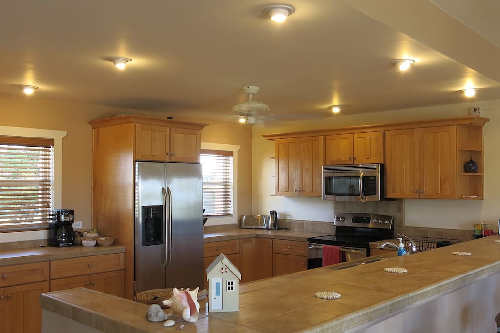 fully equipped kitchen with dishwasher oven and microwave