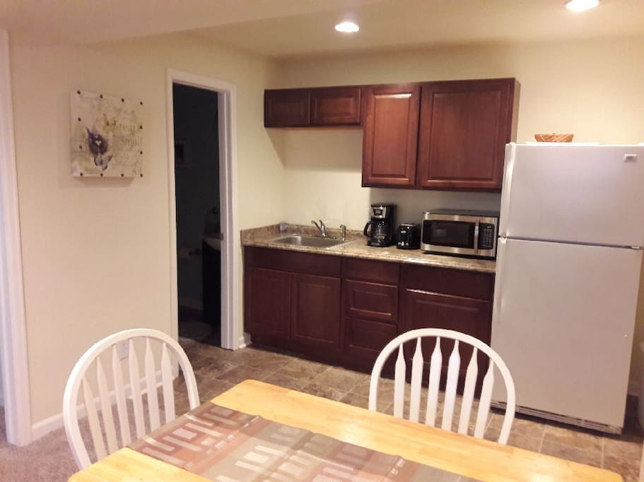 Microwave, coffeemaker, large fridge, crockpot, electric skillet. No stove.