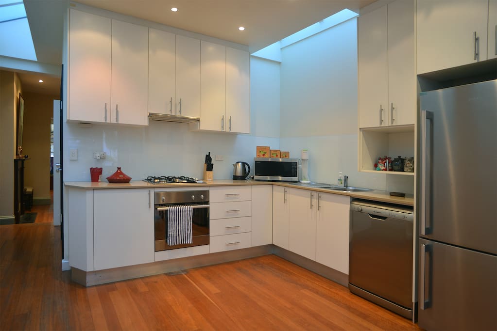 Large fridge, oven, dishwasher, gas cooktop.