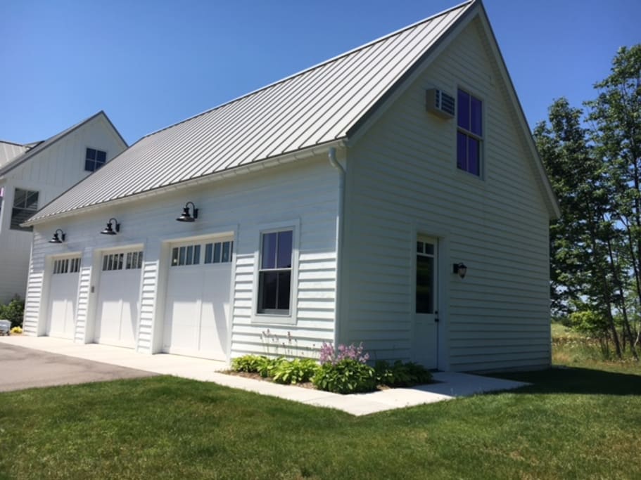 You will park in front of the garage door on the right, pictured here. The sidewalk is leading to the loft.