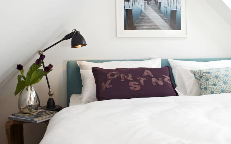 Light flooded attic apartment