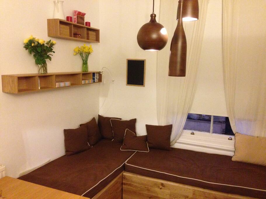 Large Sash Window, high ceiling.
Two new Bench Sofa (possibility of 2 more single beds).
