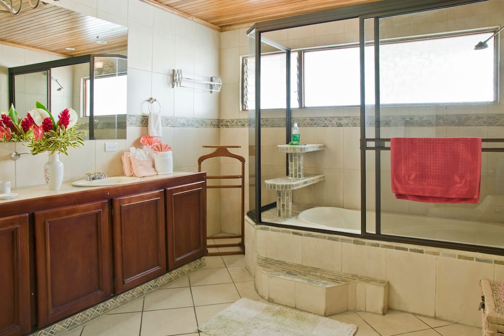 Extra large bathroom with bathtub, His & Hers sink and extra large mirror over a 6-foot vanity