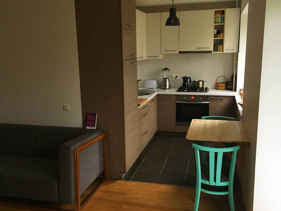 The kitchen is fully equipped and comes with a folding table and two chairs.