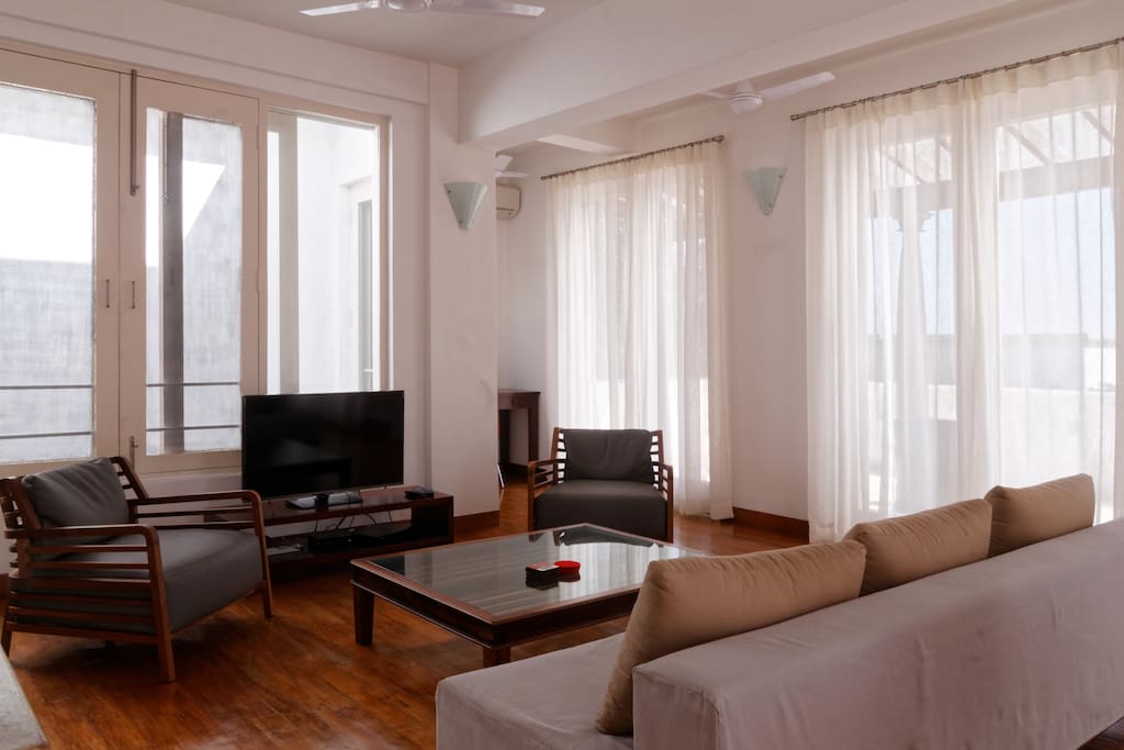 Living Room - front terrace visible through curtains