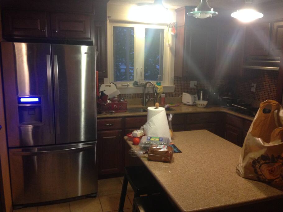 kitchen: fridge + gas stove + island