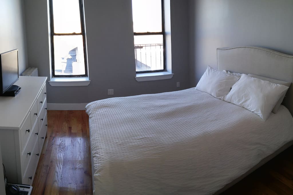 This bed is definitively NOT Ikea! A top notch Sealy mattress on Crate and Barrel's Collete frame. The bed is a queen and extra luxurious.
Chill out and gaze out at Manhattan!