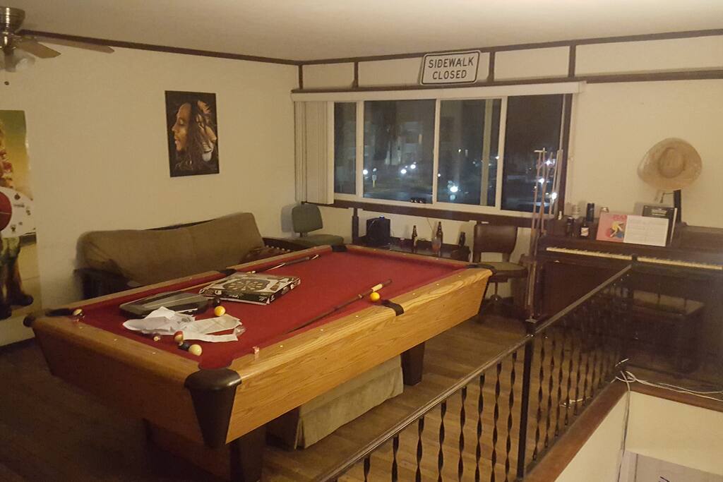 Pool table in upstairs common area along with Dartboard
