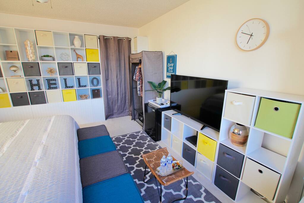 50 inch cable TV with Cable channels, Mini refrigerator, Free Wifi. Kitchen and bathroom are shared. The door is behind of the curtain.