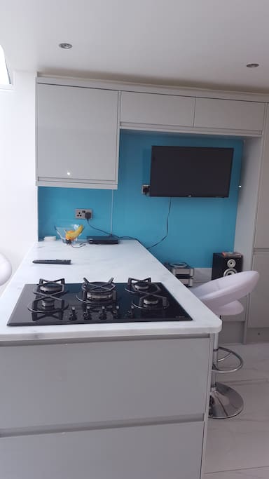 large kitchen with tv