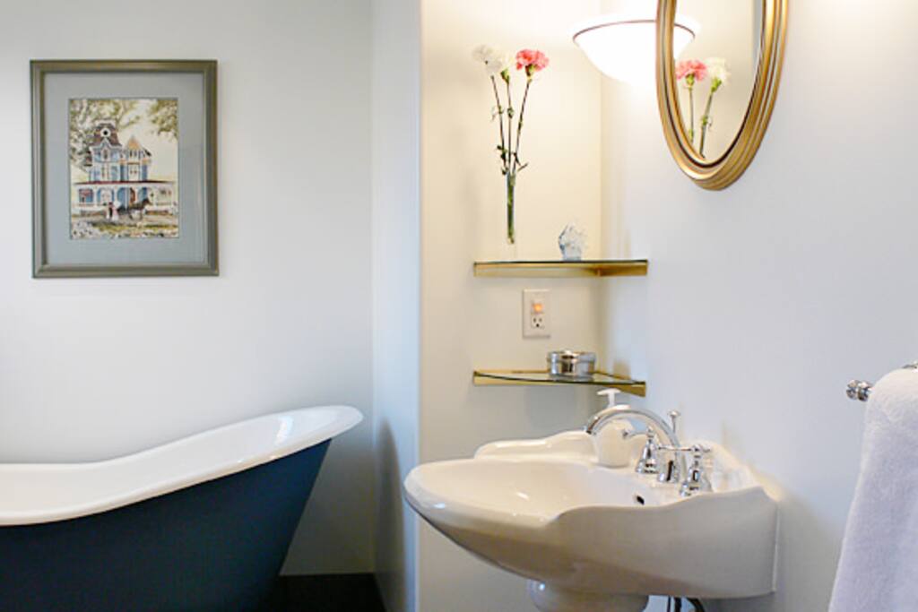 Ocean ensuite bathroom clawfoot tub and separate shower