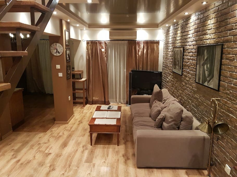 Living room with a very comfortable,big sofa.