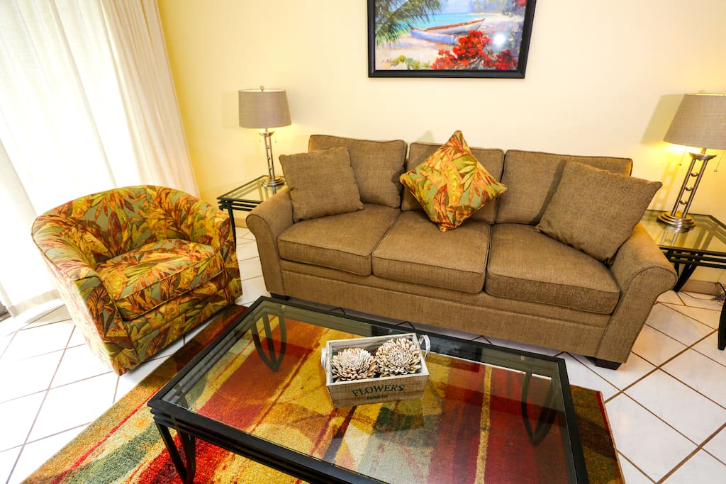 Beautiful island accents and A/C in this living room make entertaining a breeze