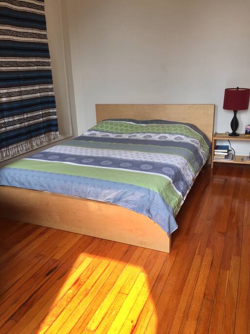 Sun drenched bedroom with very comfortable queen size bed
