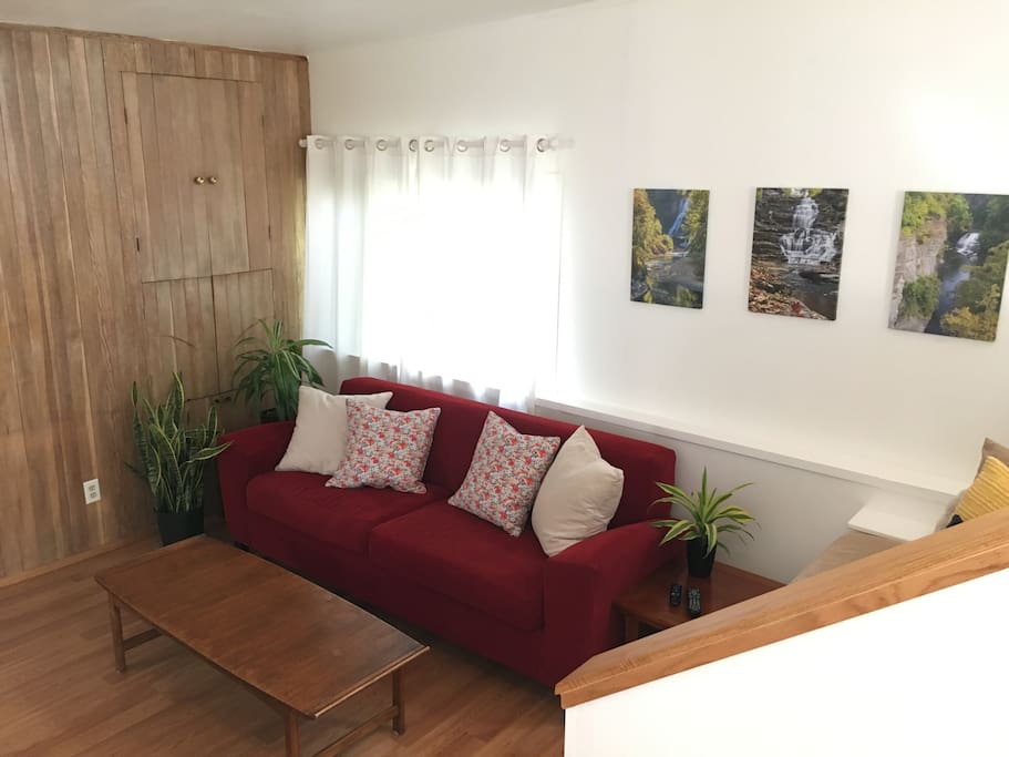 "The inside is so calming and even though small, it just feels spacious. The uncluttered layout, the clean lines of the furniture, cozy touches and windows EVERYWHERE! "