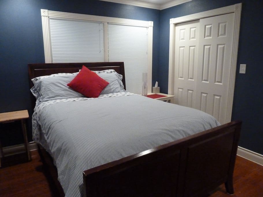 Blue room with queen size bed is perfect for sleeping late since it stays nice and dark due to hurricane shutters on the windows
