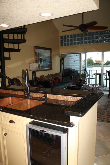 Another look through the condo showing water from the kitchen. Yes! That is a full copper sink!